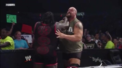 Big Show Chokeslams Mark Henry through the Announcer Table