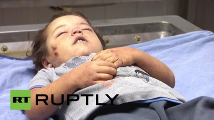 State of Palestine: Mother and daughter airstrike victims at Gazan morgue *GRAPHIC*