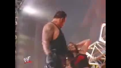 Undertaker tosses Lita off Stage