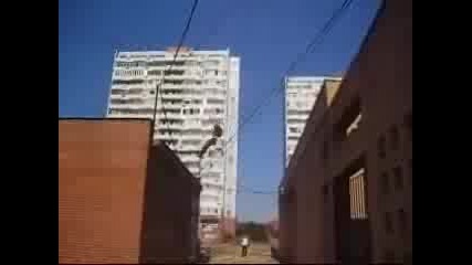 Guy jumps off roof and misses