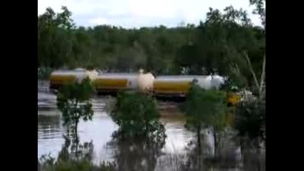 shell road train crossing a flooded river