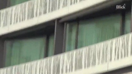 Justin waving to fans outside his hotel in Zurich