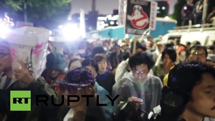 Japan: Anti-military protesters scuffle with Tokyo police