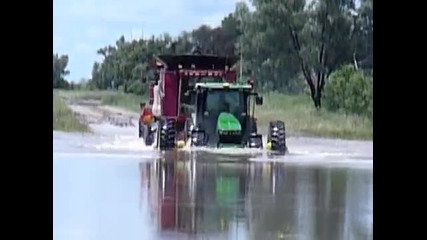 john deere and two case headers swimming