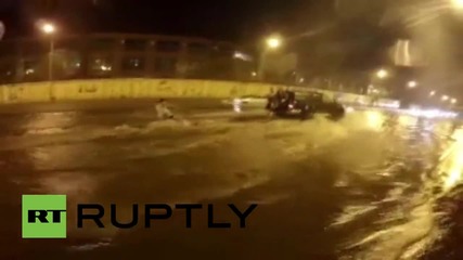 Russia: Daredevils SURF on flooded Vladivostok roads