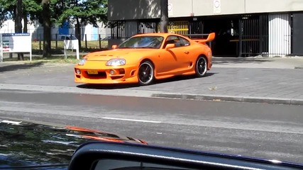 Orange Toyota Supra Driving Out Of Garage