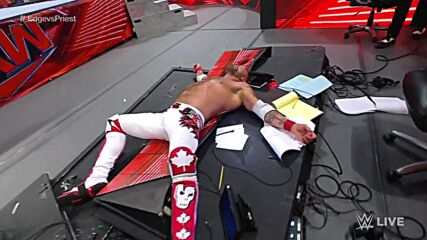 Damian Priest tosses Edge through the announce table