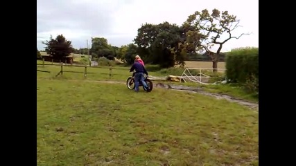 Girl crashes bike into bush