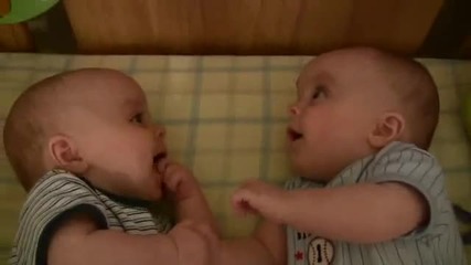 Twin Baby Boys Laughing at Each Other 