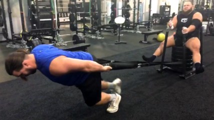 Tucker Knight gives Otis Dozovic a lift inside the WWE Performance Center gym