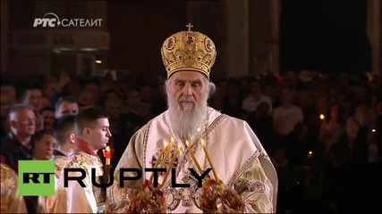 Serbia: Patriarch Irinej receives Holy Fire, leads Orthodox Easter Mass