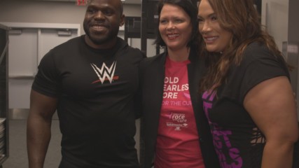 Apollo Crews & Nia Jax do a cheer for their WWE MMC charity partner Susan G. Komen