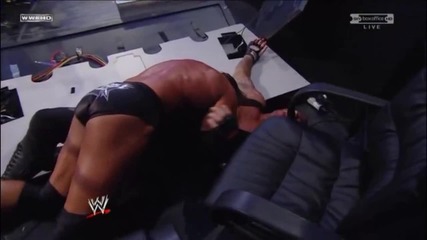 Triple H Spinebusters Undertaker into the Announcer Table
