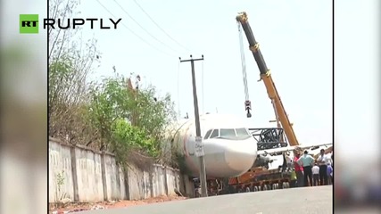 Plane Falls on Private House Following Crane Collapse