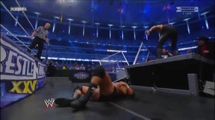 Undertaker reverses a Pedigree and throws Triple H off the Announcer Table