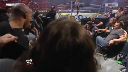 Mark Henry sends Sheamus into the barricade