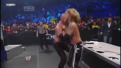 Kane Chokeslams Edge through the Announcer Table