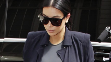 Kim Kardashian Shows off Growing Baby Bump in Tight, Plunging Outfits