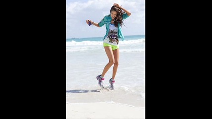 Nina Dobrev on the beach