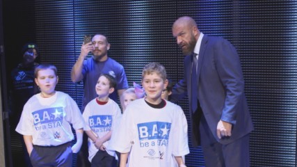 Triple H lets kids from Boys & Girls Clubs of America charge the ring