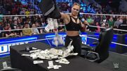 Ronda Rousey pays her fines with bags of money