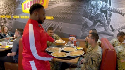The New Day serve pancakes to troops at Denny's