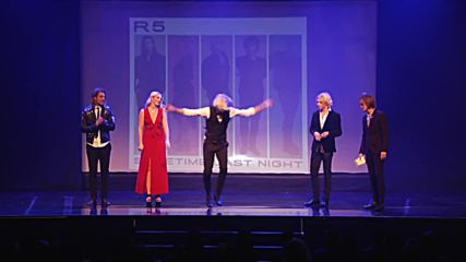 Riker Lynch does a tap routine as his band R5 cheers him on, at the World Choreography Awards 2015