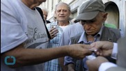 Greek Banks Reopen but Tax Jumps by 10%