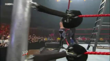 Undertaker Chokeslams Zack Ryder off the Apron through a Table