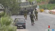 Израелски войник срещу палестинска гума