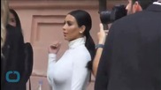 Kim Kardashian Flaunts Major Cleavage in Sexy Wrap Dress in Paris
