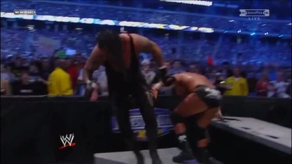 Triple H Spinebuster on Announce Table Wrestlemania 27
