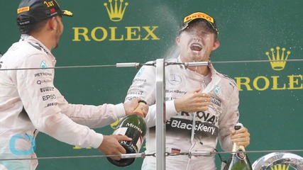 Lewis Hamilton Slammed for Spraying Champagne in Face of Hostess