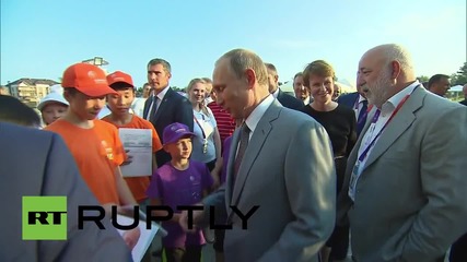 Russia: Putin explains rouble exchange rate to 11-year-old boy on Sochi visit