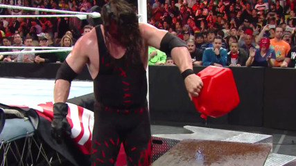 Daniel Bryan uses a fiery table to defeat Kane in an Extreme Rules Match: Extreme Rules 2014
