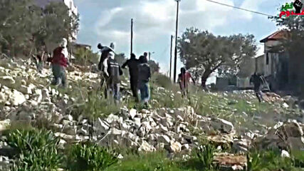 Video of Palestinian protesters stoning an Israeli drone during clashes in the village of Kufur Ka
