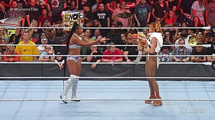 Becky Lynch "drops" the Raw Women's Championship at Bianca Belair's feet
