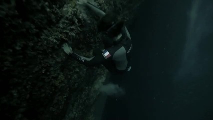 Guillaume Nery base jumping at Dean's Blue Hole