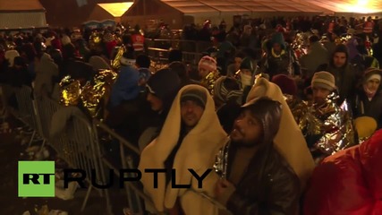 Austria: Refugees make fires for warmth at the Slovenia border