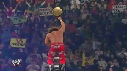 Triple H throws Shawn Michaels from the Ladder through four Tables