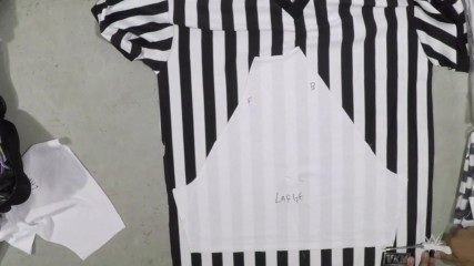 Blink and you'll miss Shane McMahon's custom SummerSlam referee jersey being created