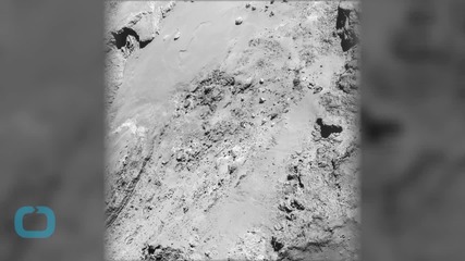 A Rock is Teetering on a Comet's Surface, But How it Got There is a Mystery
