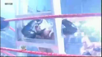Kane reverses Wheelbarrow Bulldog and throws Mysterio to a Ladder