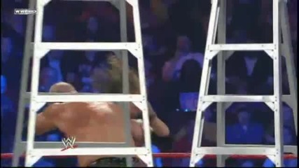 Kane Chokeslams Edge through a Table