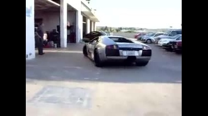 Lambo Lamborghini driving off exhaust 