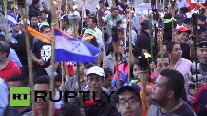 Honduras: Torch-lit march held against US interference