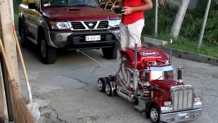 Toy_truck_pulling_a_car