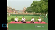 Yoga Fans Around World Take to Their Mats for First International Yoga Day