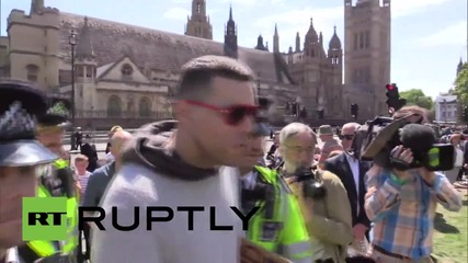 UK: Police detain two men during State Opening of Parliament event