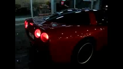 Red Corvette C5 accelerates